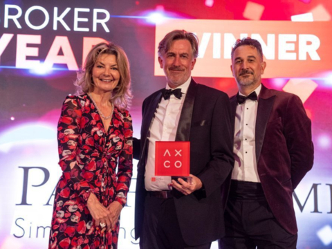 original Neil Raymond (Founder & CEO of Pacific Prime) receives the “Servicing Broker of the Year Award” on behalf of Pacific Prime.