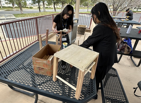 original Students work on building a wooden stool as part of their Intro to Construction course