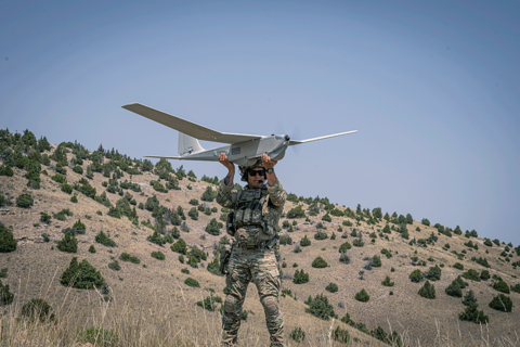 original A soldier launches the AV Puma™ 3 AE, a rugged, all-environment small UAS designed for rapid deployment (Photo: AV)