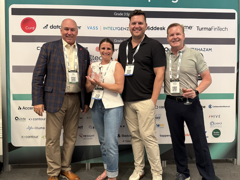 original Penny Finance accepting Best in Show at FinovateSpring 2025. Second from left: Crissi Cole, founder & CEO, Penny Finance. Third from left: Chris Timpone, head of sales, Penny Finance.