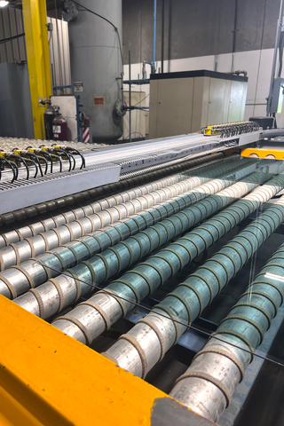 thumbnail Glass is dried before being baked in the tempering oven.