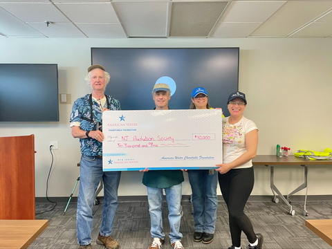 original Danielle Kearsley, Environmental Program Lead (second from right) and Idali Hanson, Operations Specialist (far right) for New Jersey American Water proudly present a check for $10,000 to David Hall, Associate Naturalist (far left), and Chris Neff, Director of Communications, (second from left), for New Jersey Audubon Society.