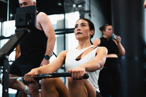 original A BFT member powers through a conditioning interval on the Rower — one of the cardio modalities used in the new conditioning testing protocol.