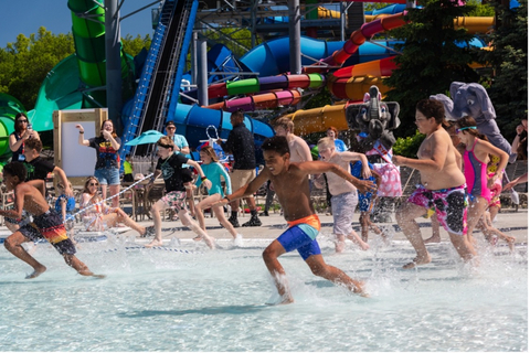 thumbnail Families race to compete in friendly competition during National Waterpark Day at Kalahari Resort.