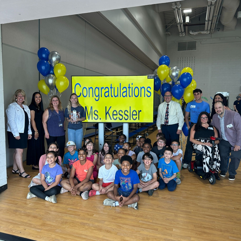 original Staff and students at Maude M. Wilkins Elementary School in Maple Shade, New Jersey, congratulate Ms. Julie Kessler (seen standing, fourth from left) on winning the 2025 Grungo Law South Jersey Teacher of the Year Award.