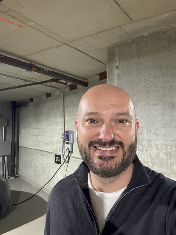 thumbnail Michael Fridshtand, CTO & Co-founder of Epic Charging, onsite at 600 N Lake Shore Drive during the migration of 148 EV chargers. Credit: Epic Charging