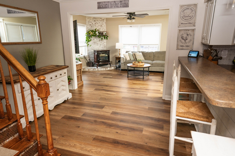 original West Shore Home showcases its full-home flooring product, transforming this living space with warmth and modern style