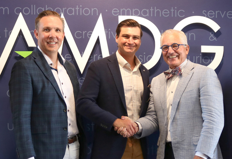 original Stonewall Group CEO, Ben Moody shakes hand of AMDG's founder, Peter Baldwin after acquisition announcement. The Stonewall Group is a national architectural and engineering firm.