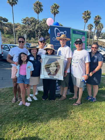 thumbnail W. Scott Burns, the recipient of one of Vivian’s kidneys and a OneLegacy ambassador, Connie Buchs, the recipient of Vivian’s lungs and a Donate Life America Ambassador, and Vivian’s family walk side by side.