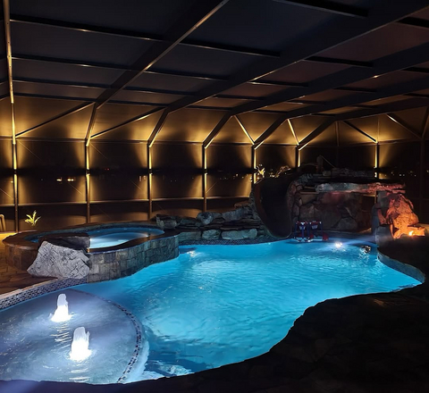 original A pool enclosure featuring integrated accent lighting, showcasing the complementary solutions offered by CRA and American Lightscapes.