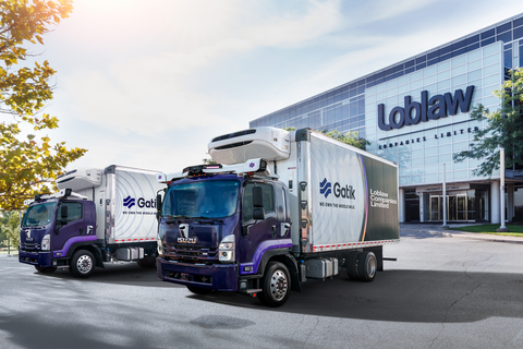 original Two Gatik trucks parked in front of Loblaw HQ