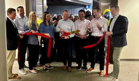 original Team members from Shield Screening and AmericanChecked celebrate the official opening of their new Tulsa headquarters with a ribbon-cutting ceremony.