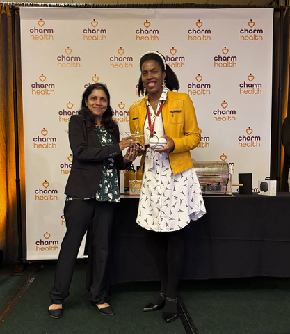 original Pramila Srinivasan, Ph.D., CEO of CharmHealth, congratulates Sanna Gaspard, Ph.D., CEO of Rubitection, winner of the First Place award at the CharmHealth Innovation Challenge.
