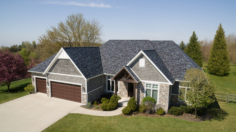 thumbnail Owens Corning has introduced Gray Tweed as part of its TruDefinition® Duration® Designer line. Gray Tweed brings a rich, dimensional gray interspersed with flecks of soft browns and black to create quiet sophistication that transforms any home exterior into a haven of warmth and charm.