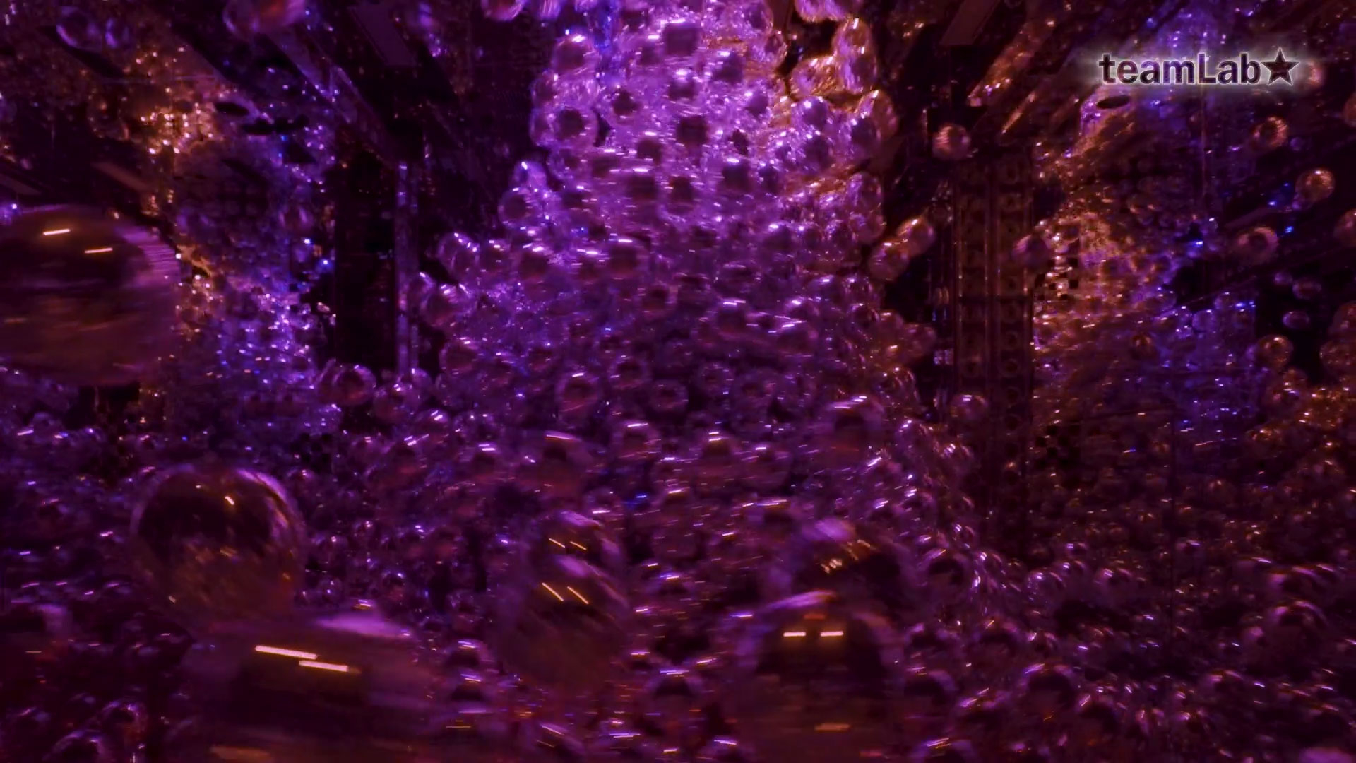 thumbnail Even if individual elements are separated in space and time, when a structural order appears among them, the elements transcend space and time and form a single entity. Despite significant changes in shape or size on the surface, or even if all of the elements are replaced, the single existence will be maintained. This spatiotemporal existence is part of the whole, it appears from the whole, and is returned to it. It is a living universe - a biocosmos. (teamLab, Morphing Continuum © teamLab)