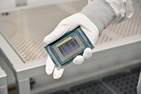 thumbnail An Intel manufacturing technician holds a Clearwater Forest chip inside the cleanroom of Intel’s new Fab 52 in Chandler, Arizona, in September 2025. Fab 52 is the U.S. home to Intel 18A, where Clearwater Forest, a data center processor, will be manufactured. (Credit: Intel Corporation)