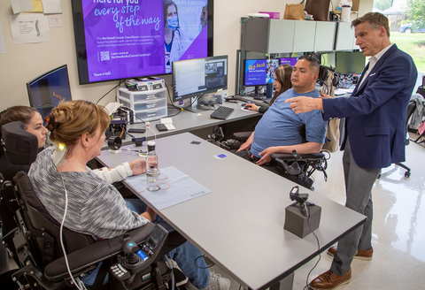 original The Double Neural Bypass innovation is led by Chad Bouton, PhD (far right) seen with clinical trial participants Keith Thomas and Kathy Denapoli (left).