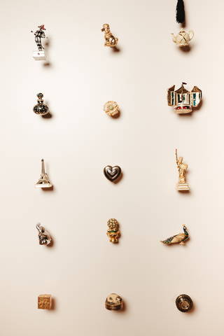 thumbnail Estée Lauder solid fragrance compact wall – which includes 272 heritage compacts. Ranging from 1970s-2010s. 