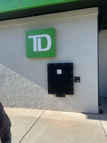original Custom flood panel protects an exterior ATM machine at a TD Bank location