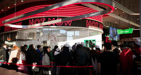 original Customers line up for the Grand Opening of the first Krispy Kreme shop in Spain