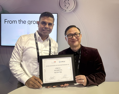 original Raymond Qu, Group CEO and founder of Geoswift, and Sunil Sharma, VP Product Management at Circle, celebrating the partnership in Las Vegas.