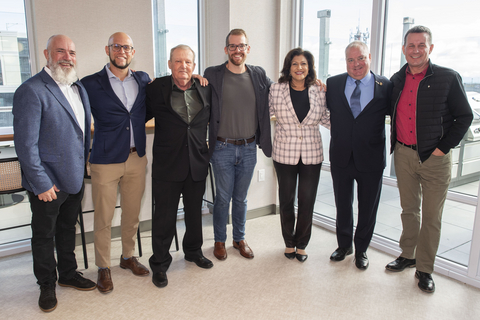 original Senior leaders gathered at the Welcome Home Celebration at The Kith Condominiums in Erin Mills, Mississauga. Photo by: Arthur Mola Standing left to right: Don Pugh, Partner, The Daniels Corporation, Jake Cohen, President, The Daniels Corporation, Keith Tansley, Executive Director, Community Living Mississauga, Adam Hagedorn, Principal, Portfolio Management, BGO, Nina Tangri, Member of Provincial Parliament, Mississauga-Streetsville, Brad Butt, Ward 11 Councillor, City of Mississauga, Chris Beesley, Chief Executive Offer, Community Living Ontario.