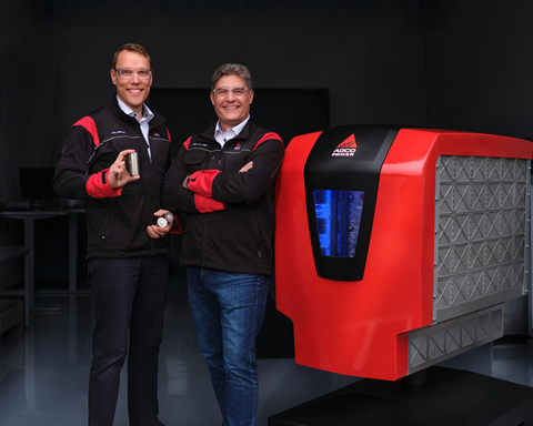 Juha Heikkilä (left), Manager Electrification, holds NMC battery cells used in the prototype battery, while Kari Aaltonen, Director Engineering, stands beside the concept unit. The battery, designed by AGCO Power, contains a total of 1400 cells and offers 150 kWh of capacity.