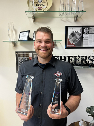 Marshall Moore, Director of Community Impact and Financial Well-being, pictured here with On Tap Credit Union's 2025 Diamond Awards.