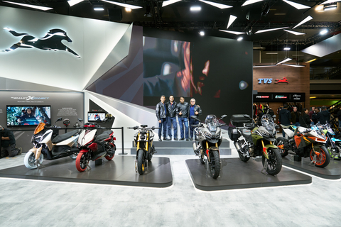 original TVS top leadership team posing with the global showcases at EICMA. From L to R: TVS M1-S, TVS X, TVS eFX three O, TVS RTX 300 and RTX 300 BTO, TVS Tangent RR Concept and RTR HyprStunt Concept.