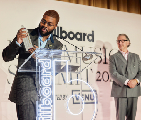 Khalid receives the Billboard Disruptor Award, presented by VENU, at the Billboard Live Music Summit in Los Angeles. (Photo: Rashida Zagon)