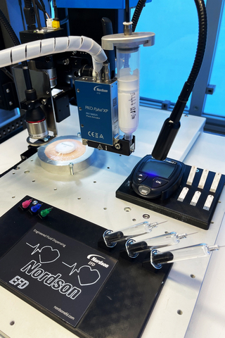 A PROPlus robotic fluid dispensing system utilizes a Cardiac Care Card with intricate shapes to demonstrate micron-level deposition of fluids such as adhesives, lubricants and more.