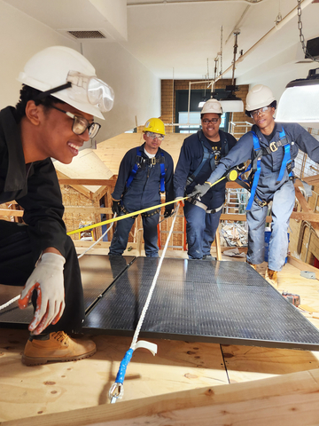 Bronx Design & Construction Academy high school students participate in Solar One’s Green Design Lab class focusing on grid-tied solar installation on a full-scale and to-code house built by the students. Photo: NineDot Energy
