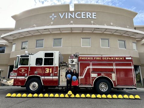 Founders radiation oncologist Dr. Vershalee Shukla and surgeon Dr. Pablo Prichard standing in front of the Vincere Cancer Center in Scottsdale, Arizona.