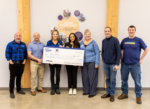 HuskyHack 2025 winner Riddhi Bajaj (center) with event judges. Photo courtesy of Olivia Carson, University of Washington Tacoma.