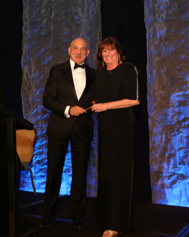 original Suffolk Executive Vice President, National Transportation, Sam Sleiman begins his tenure as Chair of the National Academy of Construction, accepting the ceremonial gavel from outgoing Chair Christine Keville.