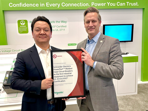 Bin Lu, executive vice president, Power Products, at Schneider Electric and Jeff Smidt, senior vice president of Testing, Inspection and Certification, Industrial, at UL Solutions, celebrate the first ECOLOGO Certification for an industrial product, with the certification of Schneider Electric’s portfolio of PowerPacT™ Molded Case Circuit Breakers, during Schneider Electric’s Innovation Summit North America in Las Vegas.
