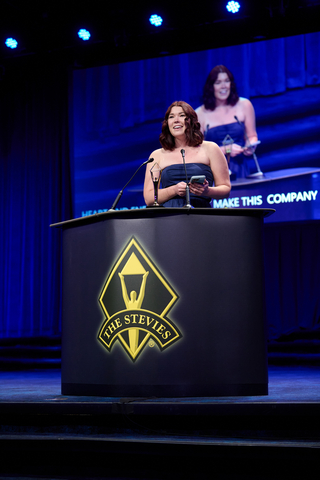 Amanda Desuacido, CEO of My Mountain Mover, accepting the gold Stevie Award for Women-Run Workplace of the Year.  My Mountain Mover provides HIPAA compliant virtual medical assistants.