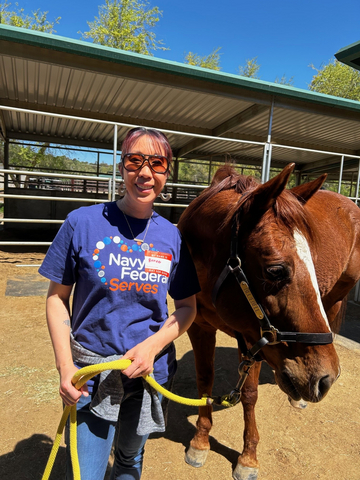 thumbnail Community impact story: Navy Federal’s Renee Hoglen, a military spouse, this year channeled $1,000 to REINS of Valor, a horse therapy program for Veterans. Hoglen, a longtime volunteer, worked with colleagues to repair the ranch and raise funds. “’Our members are the mission’ is our motto, and I see that same spirit in REINS—serving and connecting both the local and military communities,” Renee says. 