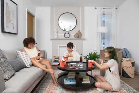 original Outpost coliving residents hang out together in one of their apartment's shared spaces