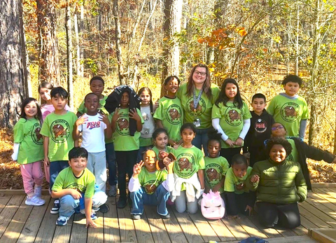 Second grade students from Bryant Elementary School in Mableton, Ga., along with teacher Kortney Bryant (back row, 4th from right), visited Bear Creek Nature Center in Chattahoochee Hills, Ga., on Nov. 18, 2025, part of a new Buddy Bison™ School Program funded by Symetra.