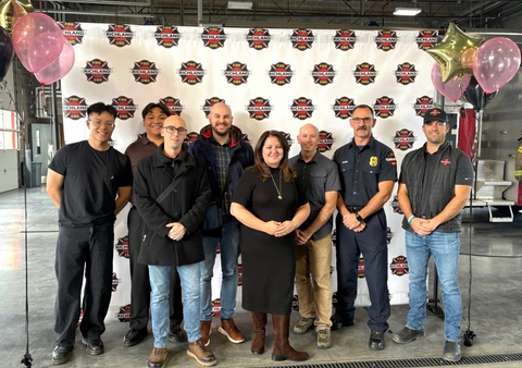 Laura Rea Dickey, CEO of Dickey's Barbecue Restaurants, Inc. and Ken Bush, Franchisee of the Richland Dickey's presents an $8,200 Grant to the Richland Fire Department on behalf of The Dickey Foundation