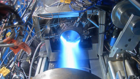 thumbnail Ignition confirmed at altitude: The flight-ready Frenzy™ engine is pictured successfully firing during vacuum chamber testing in Ohio. Flight tests are slated for early 2026. [PHOTO CREDIT: Beehive Industries]