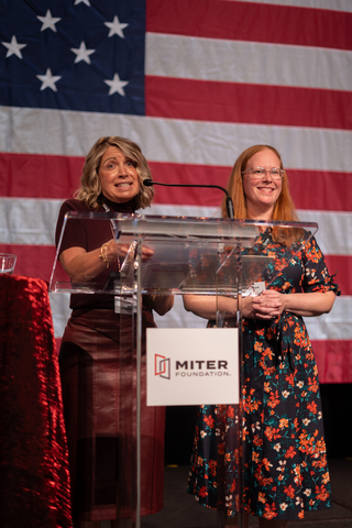 thumbnail From left to right: Gwen Mallon, MITER Foundation Specialist, and Amanda Klinger, MITER Foundation Program Manager, speaking at the gala on the first night of the Hershey golf outing
