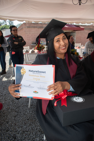 thumbnail A NatureSweet employee in San Isidro, MX, earns her degree through the company's Adult Education program. 