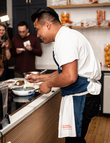 original Chef Jordan Andino cooking at the Florida Orange Juice "Walking in a Citrus Wonderland" event.