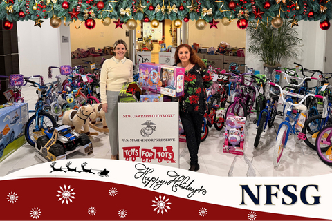 original Led by Chief Operating Officer Gina Buddie (right), the NFSG team gathers with this year's record-breaking toy drive donations, continuing a 20-year tradition of giving back to the community.