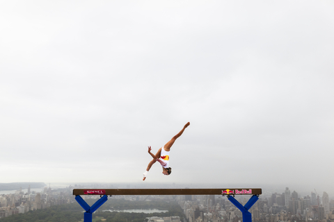 Lily Smith performs gravity-defying beam routine 52 stories above the streets.