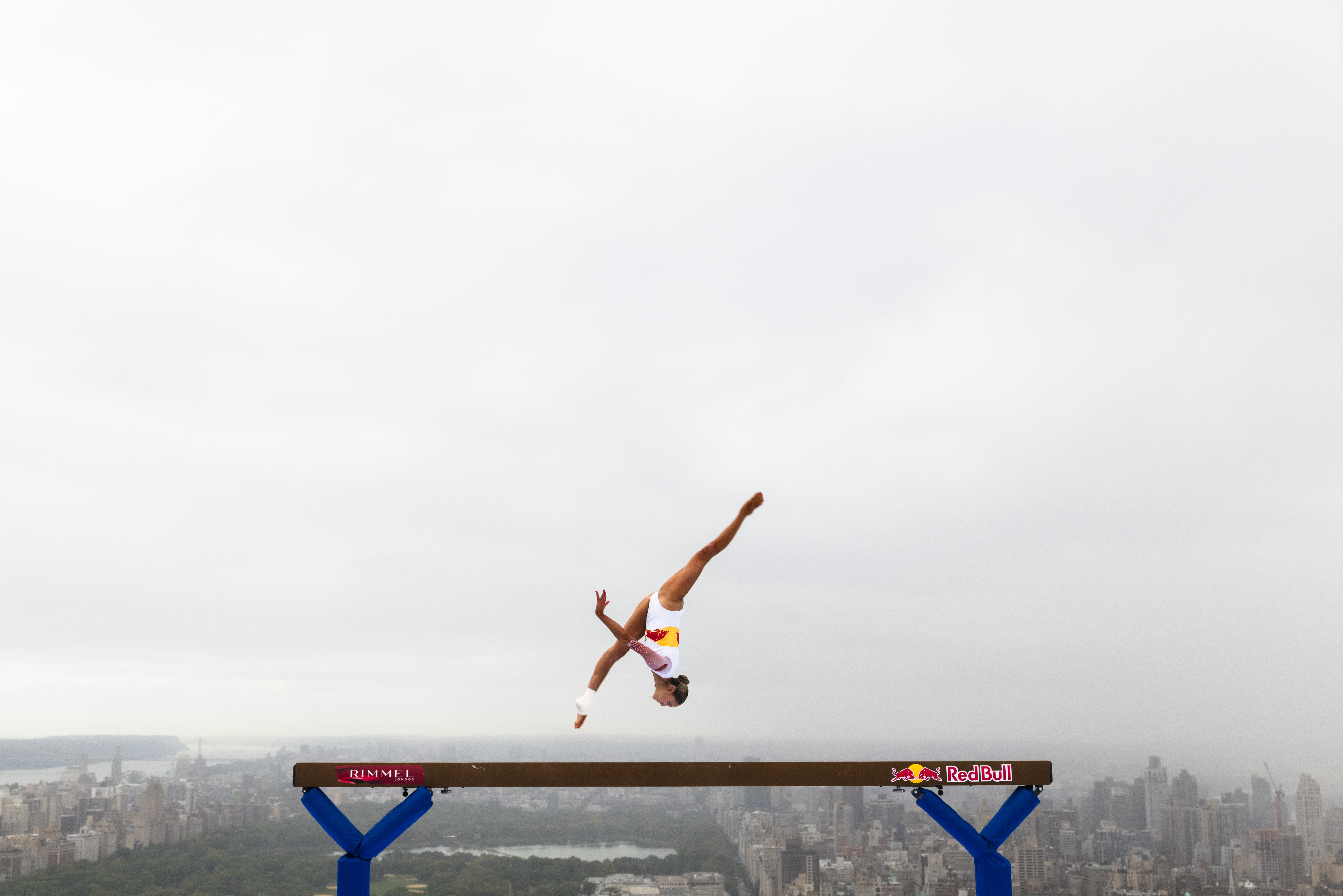 Lily Smith performs gravity-defying beam routine 52 stories above the streets.
