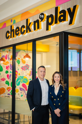 The founders of Check N’ Play in front of the brand’s flagship play café at Brea Mall in Brea, Calif.