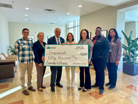 original A check is presented to Roseman University College of Medicine by (center) Kimberly Gahagan, AVP of Growth & Community Engagement for Molina Healthcare of Nevada. Also pictured (left to right) are Roseman University College of Medicine's Dr. Farzad Kamyar, Dr. Karin Esposito, Dr. Pedro Greer, Jr., Dr. Andria Peterson, Rachael Mack, and Dr. Nirupa Paulraj. 
